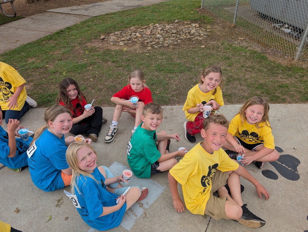 group of students sitting on the ground