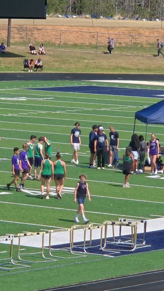 Students on the field between events
