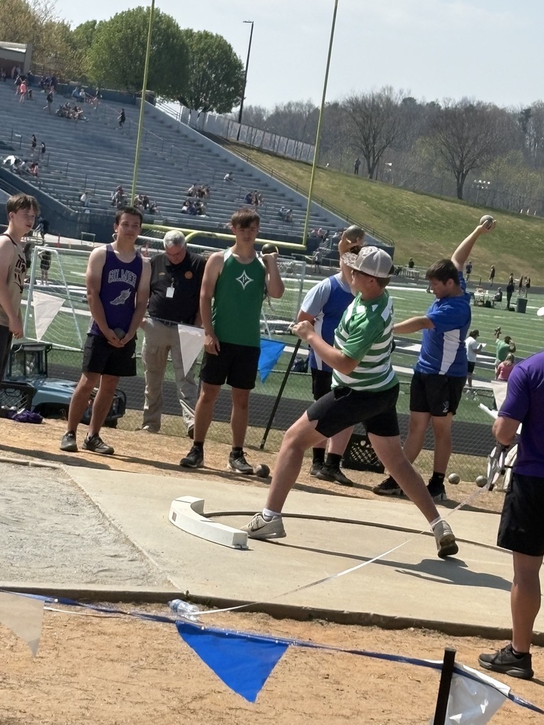 Student competing in shot put event