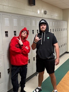Two teachers wearing hoodies