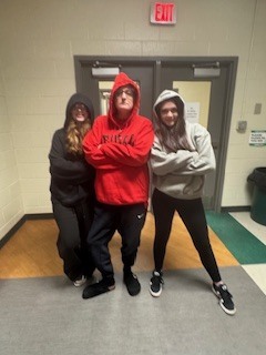 Teacher with two students dresse3d alike