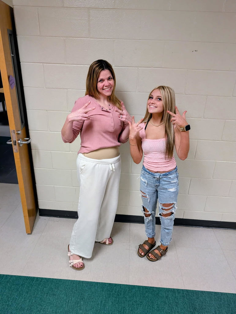 A teacher and student dressed alike