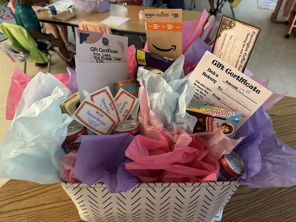 gift basket full of gifts and colorful tissue paper