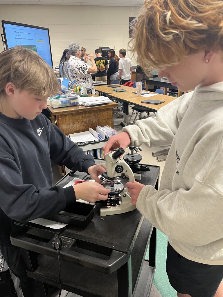 Student working with a microscope