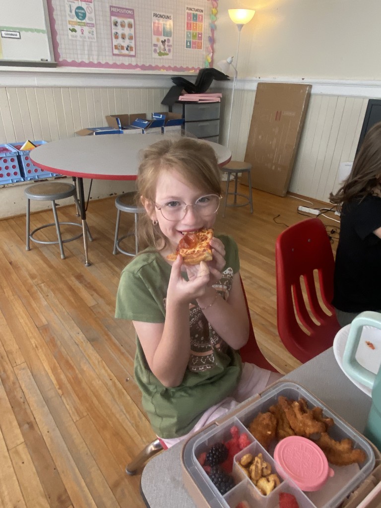 Girl eating pizza