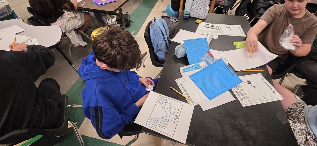 student completing an escape room