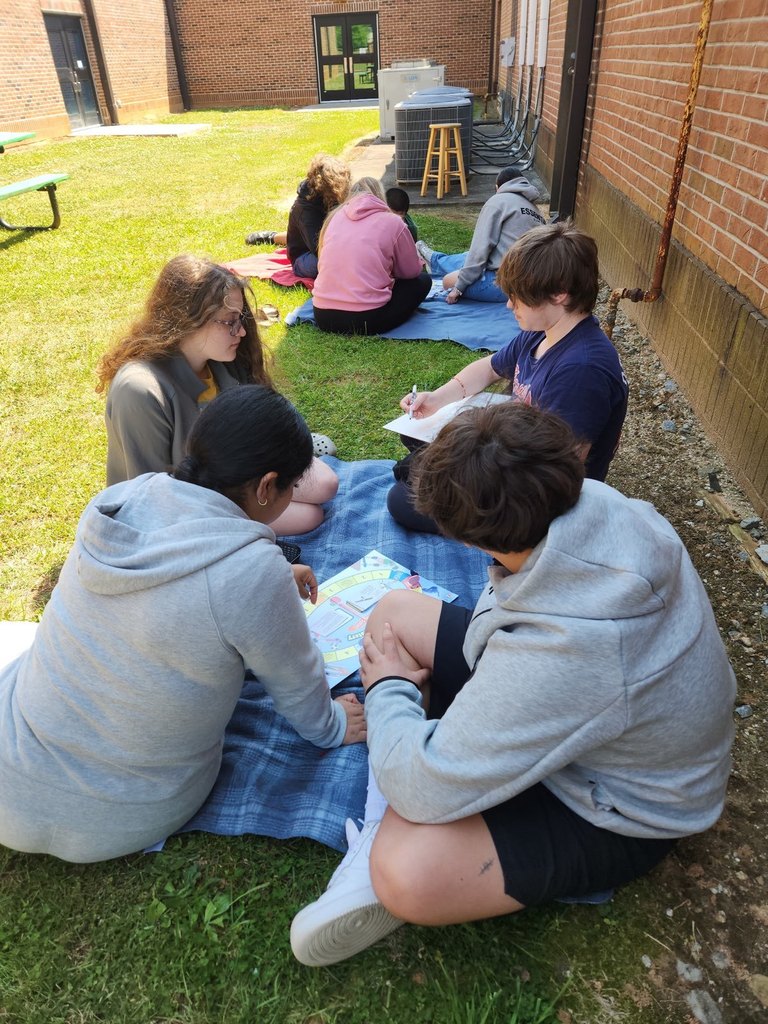 2 groups of students working on a science activity