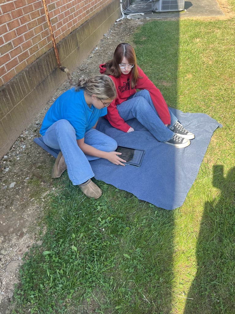 2 students completing a science activity