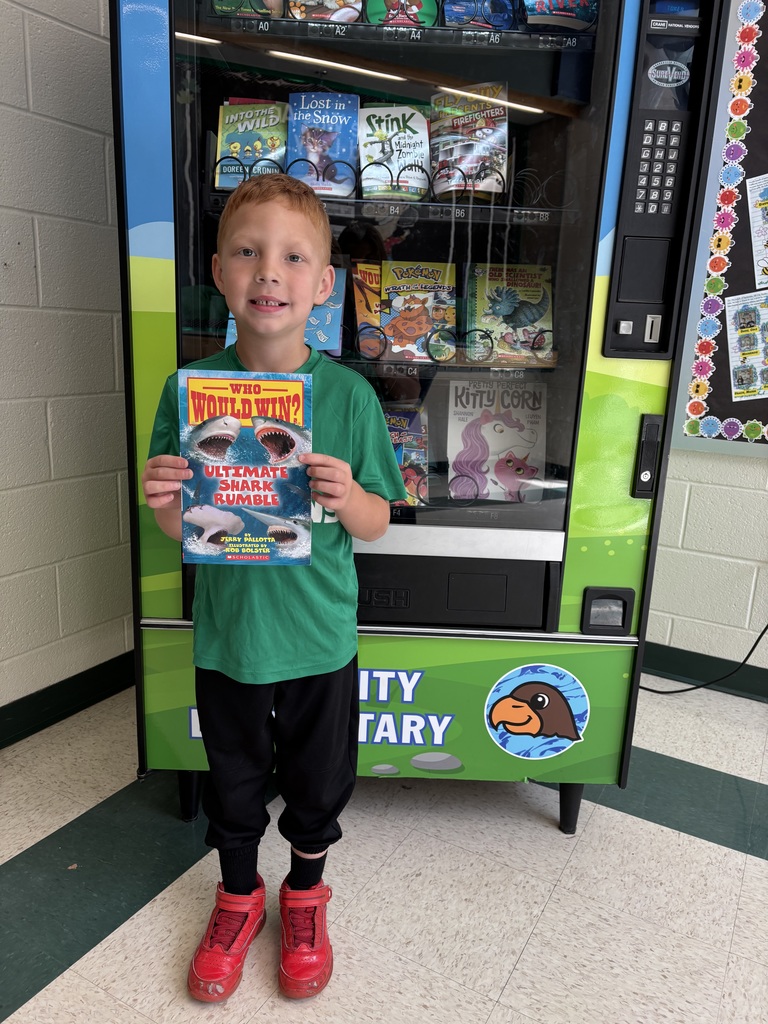 Braxton achieved another reading goal and earned a trip to the Book Vending Machine.