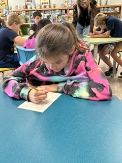 Here’s Mrs. Connelly’s class of talented poets working hard in the media center with Mrs. Hardison and Mrs. Jamie on blackout poetry.