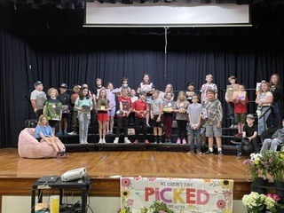 Group of students standing on a stage