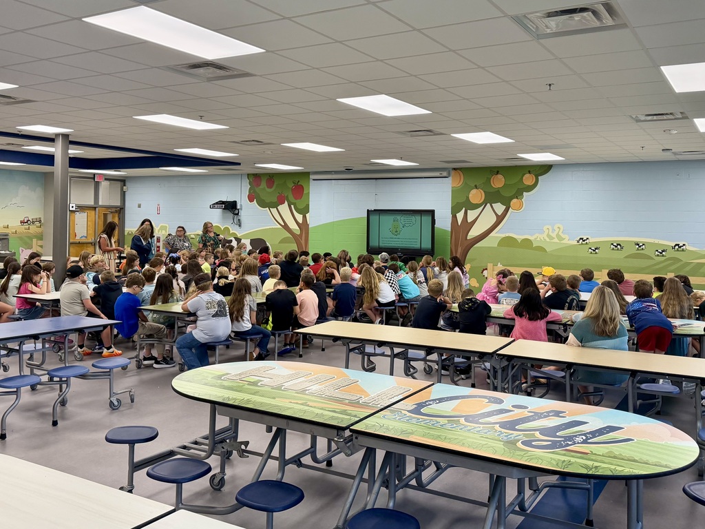 Fourth grade students reviewing appropriate cafeteria behavior and Leader in Me habits.