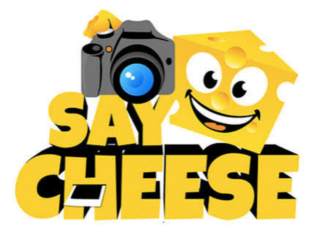 Say cheese - a piece of cheese is holding a camera