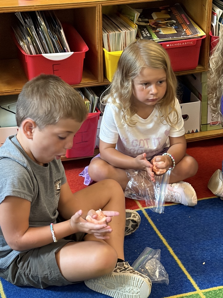 Mrs. Abbott's kindergarten read "Our Class is a Family," and celebrated their unique classroom family with Play-Dough and family bracelets.