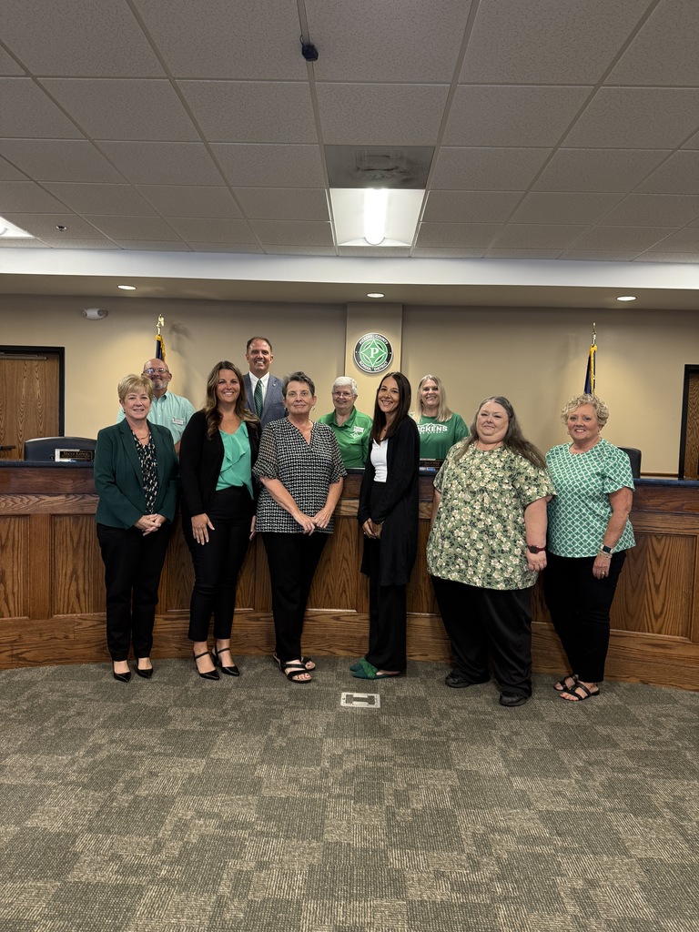 Finance team recognized at the board meeting. 