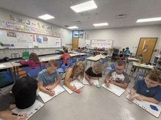Mrs. Shealey's first graders in small group and center time reviewing  "short a."