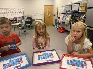 Mrs. Shealey's first graders in small group and center time reviewing  "short a."