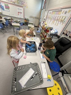 Mrs. Shealey's first graders in small group and center time reviewing  "short a."