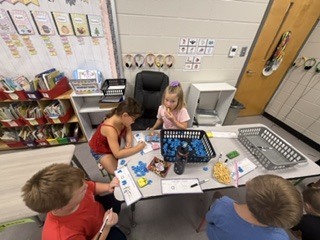 Mrs. Shealey's first graders in small group and center time reviewing  "short a."