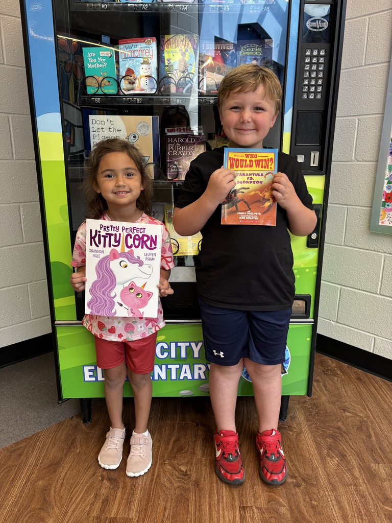 Lola and Mack from Ms. Jenkins's class have mastered their letters, letter sounds, and numbers 0–20! They earned a special visit to the Book Vending Machine to celebrate their hard work. 