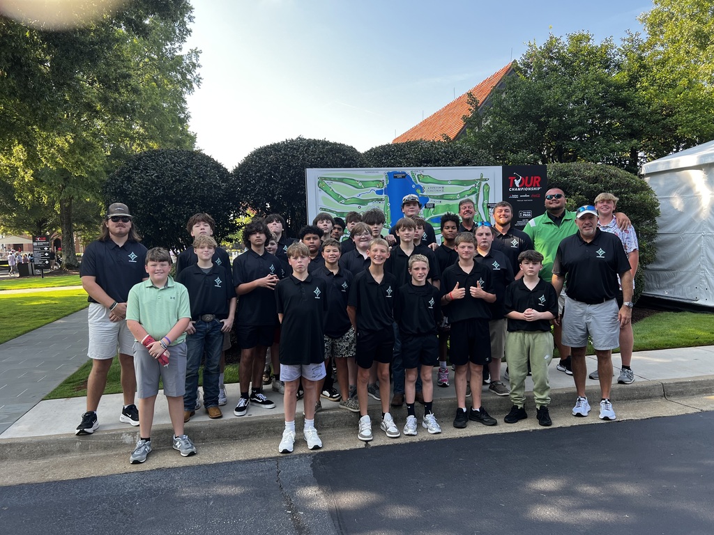 Group photo of students at the golf center