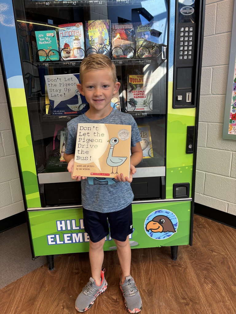 Nate mastered his fluency folder and earned a trip to the Book Vending Machine!