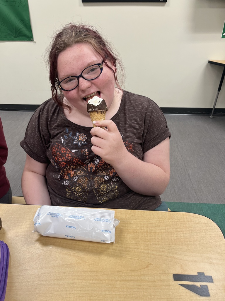 Girl enjoying eating her ice cream cone at lunch