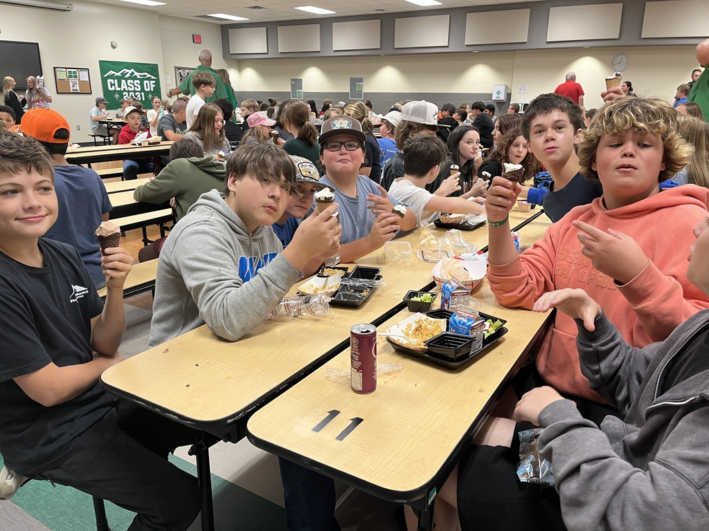 Group of boys enjoying their ice cream cones at lunch