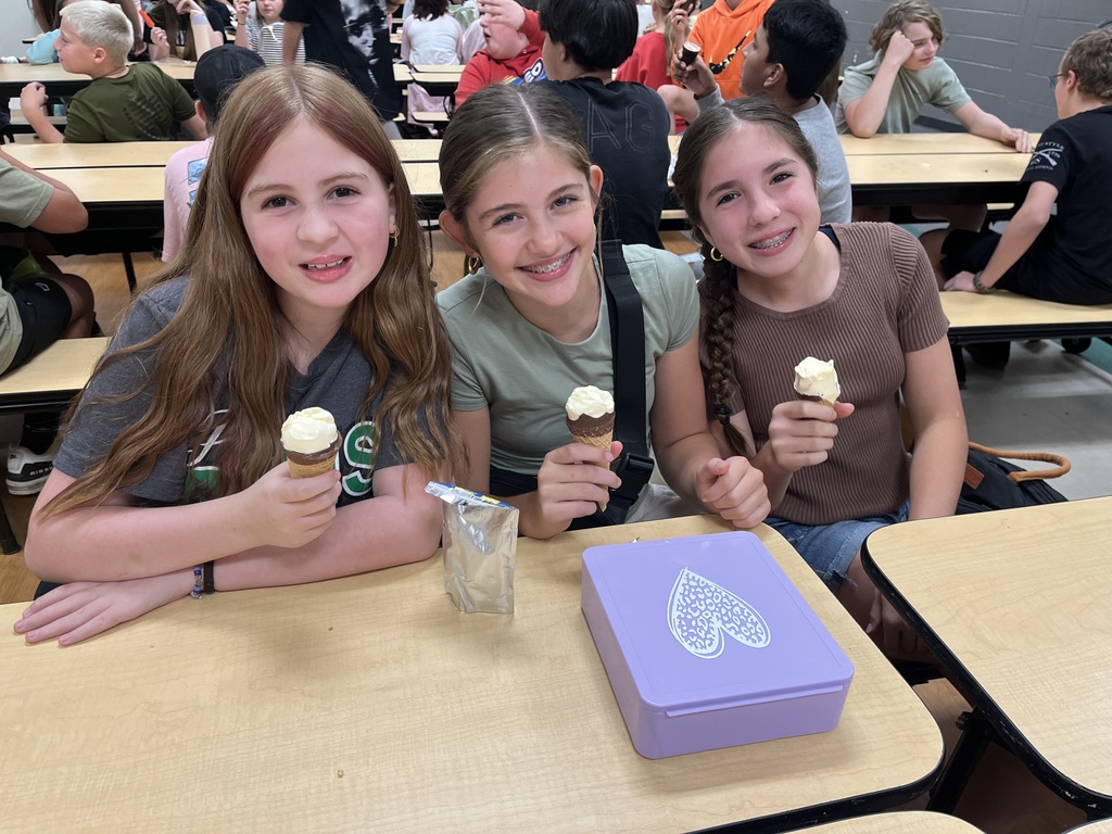 Friends eating their reward ice cream at the lunch table