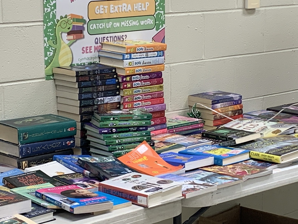 books stacked on the book share table