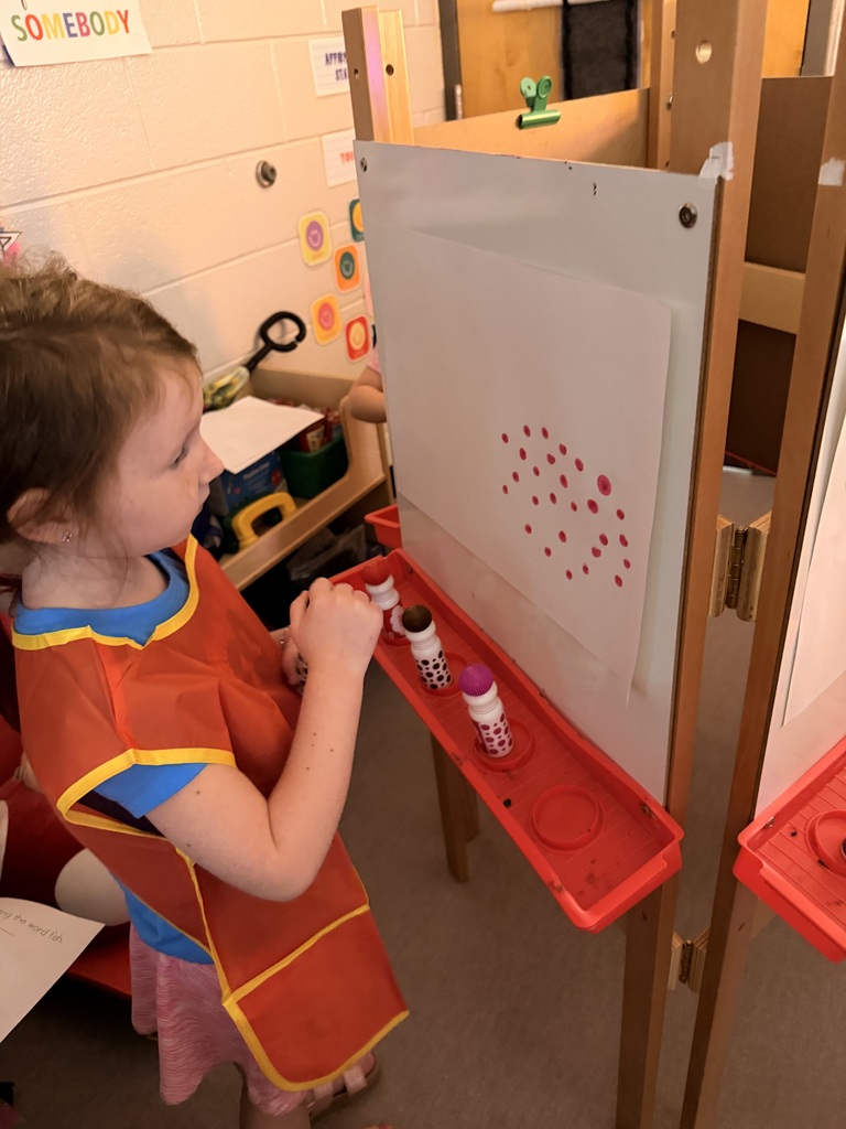 Painting in Mrs. Allen's PreK class.