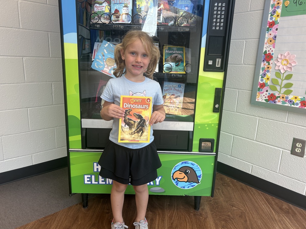 Nova visited the Book Vending Machine for completing her fluency folder.