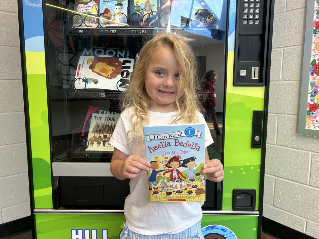 Cameron went to the Book Vending Machine for finishing her fluency folder.
