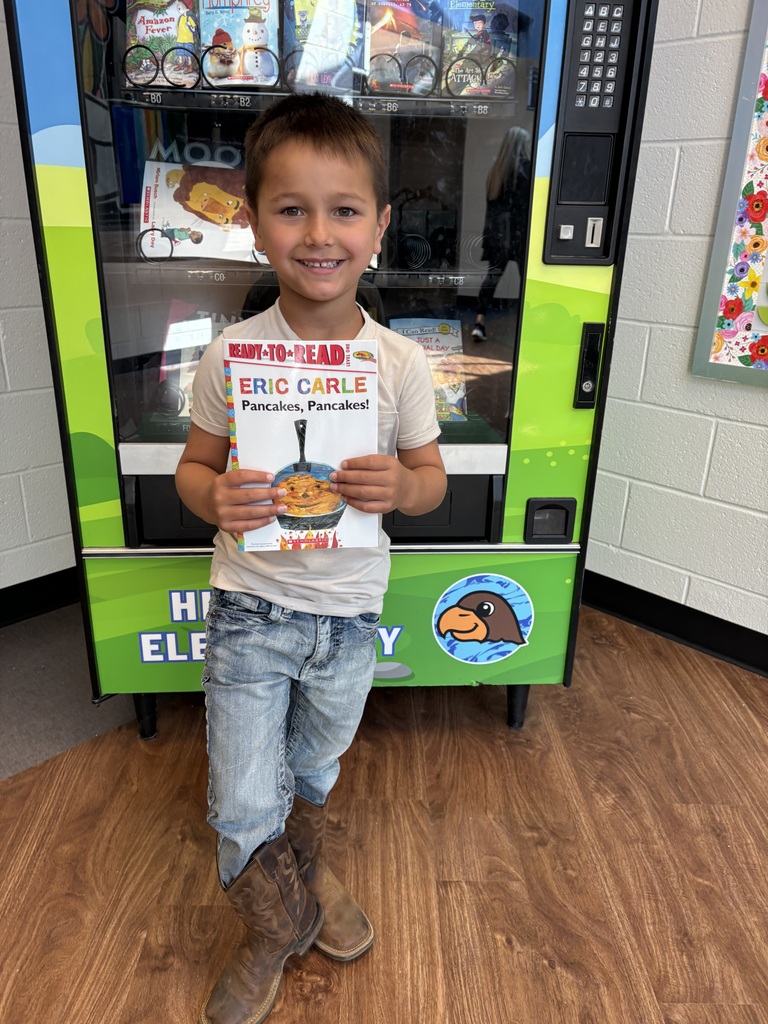 Mack earned a book from the Book Vending Machine for completing his fluency folder.