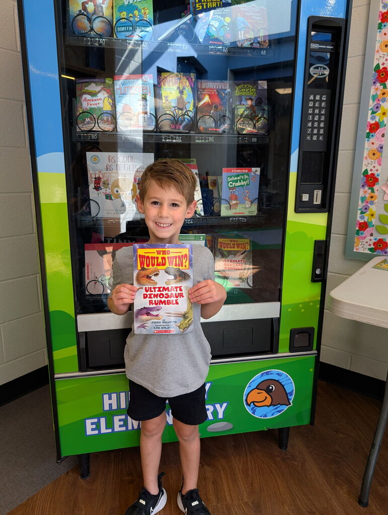 Lawson in Mrs. Roper's kindergarten finished his fluency folder and earned a trip to the Book Vending Machine.