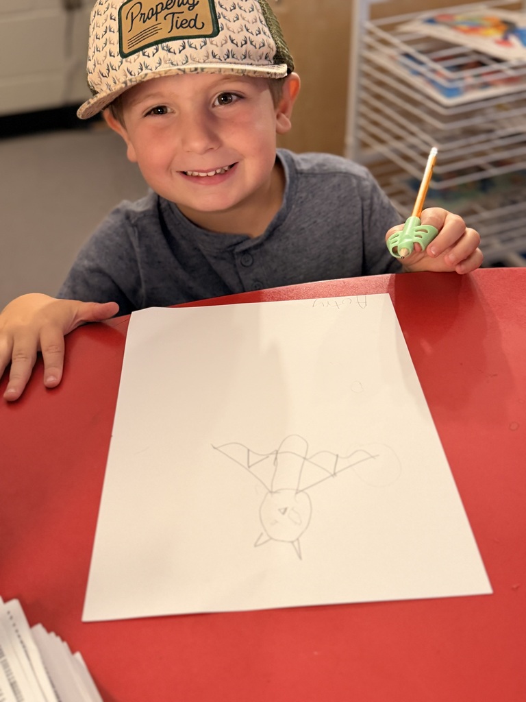 Student in Mrs. Allen's PreK drawing a bat.
