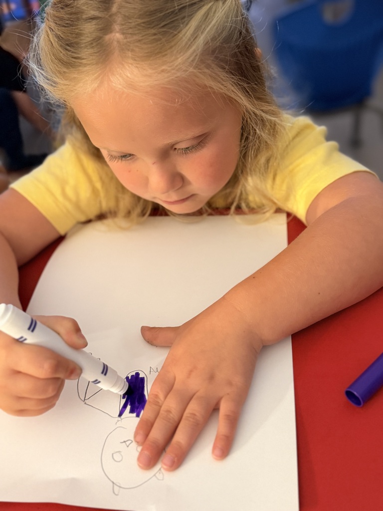 Student in Mrs. Allen's PreK drawing a bat.