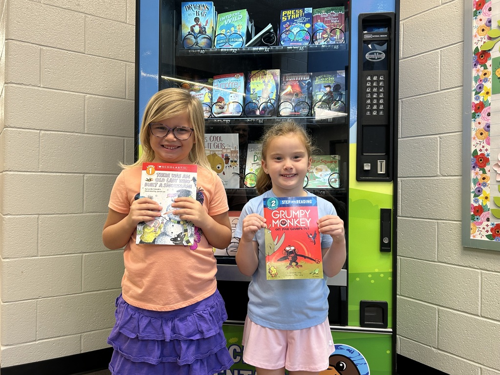 Sierra and Sutton earned new books from the Book Vending Machine.