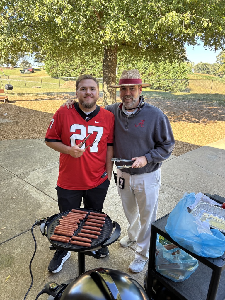 Mr, Billy and Coach Rasco cooked hot dogs.