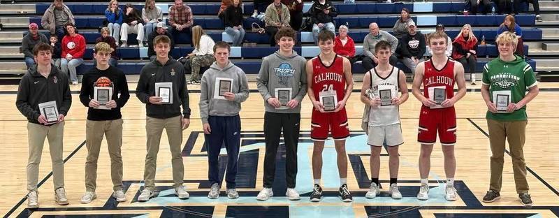 basketball athletes smiling with awards
