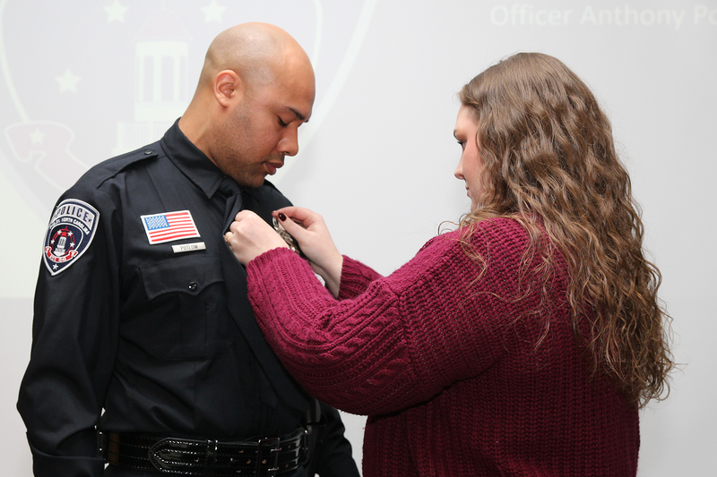 Officer Potlow being pinned with his badge