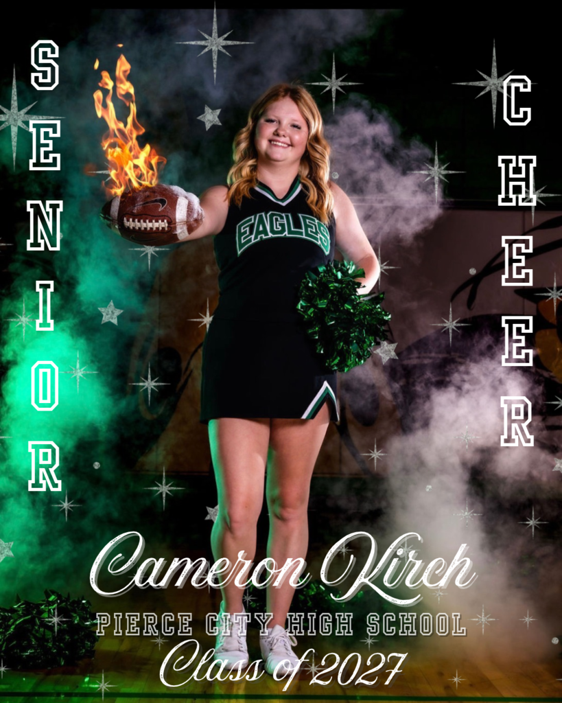 senior picture of cheerleader holding a football that's on fire