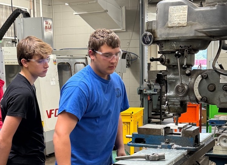 student on cnc machine