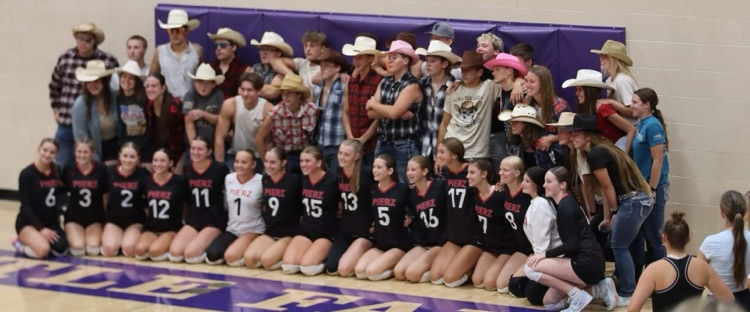 volleyball players with students dressed up in country theme 