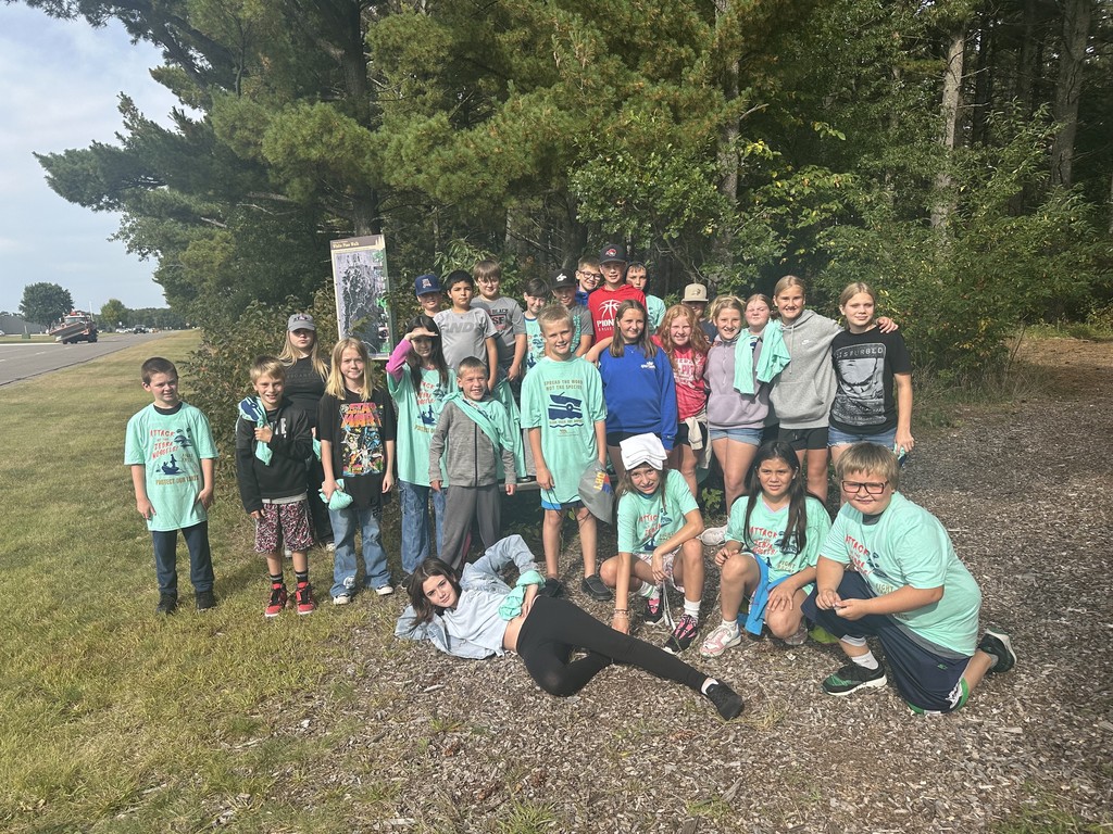 group of students looking at camera for photo outside of camp ripley
