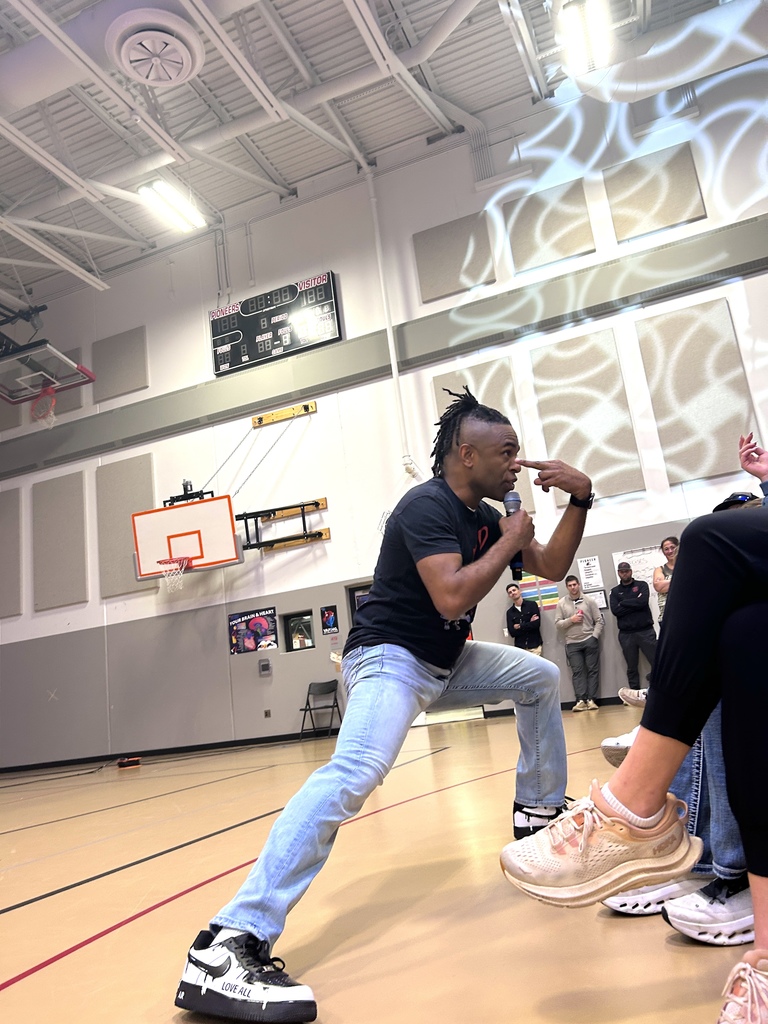 Terrence talking to students in bleachers