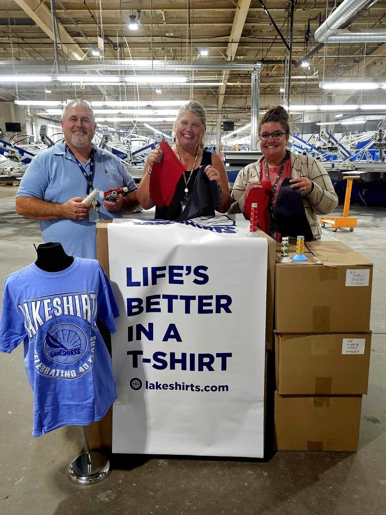 3 people with Lakeshirts logo shirts looking at camera smiling