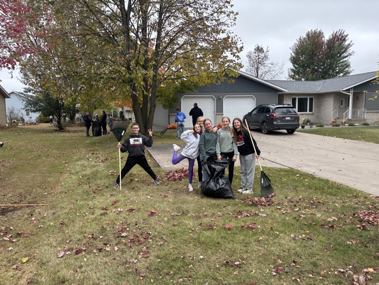 students bagging leaves