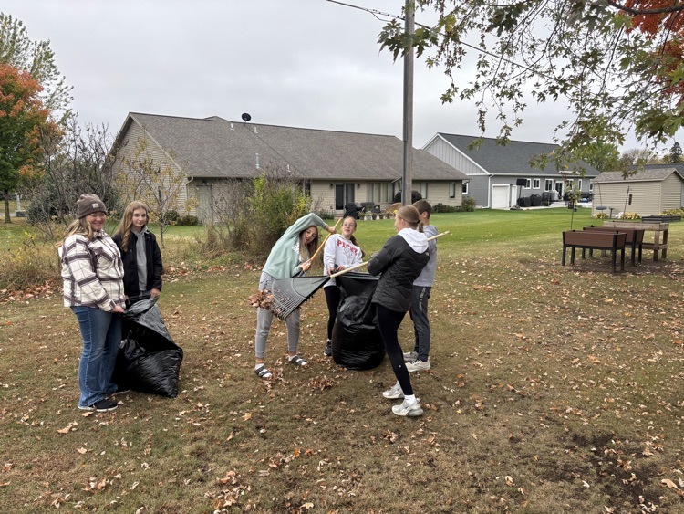 students raking