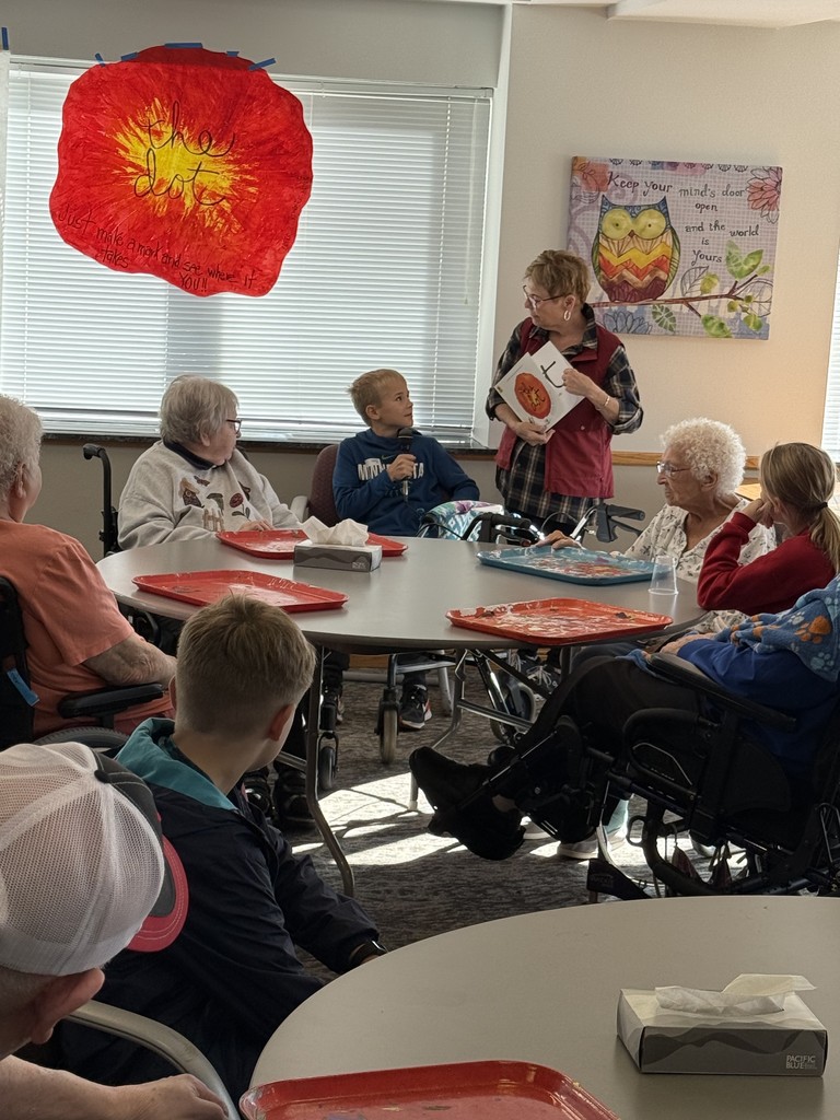 Students doing art with residents